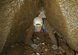 A low crawl over cobbles - Town Drain Cave